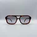 Close-up of vintage-inspired frame crafted from premium brown tortoiseshell acetate and grey-tinted lensesfrom independent rock ’n’ roll–inspired eyewear brand Dirty Rocker. David Bowie inspired sunglasses.