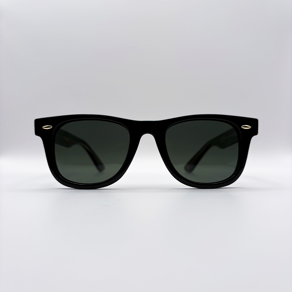 Close-up of vintage-inspired solid black Wayfarer frame with a high-gloss finish and black polarised lenses unisex vintage inspired tinted sunglasses from independent rock ’n’ roll–inspired eyewear brand Dirty Rocker 
