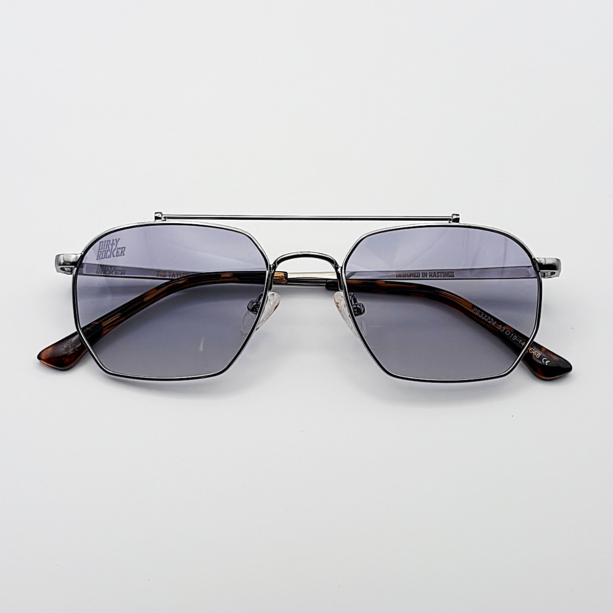 Close-up of blue unisex vintage inspired tinted sunglasses from independent rock ’n’ roll–inspired eyewear brand Dirty Rocker 